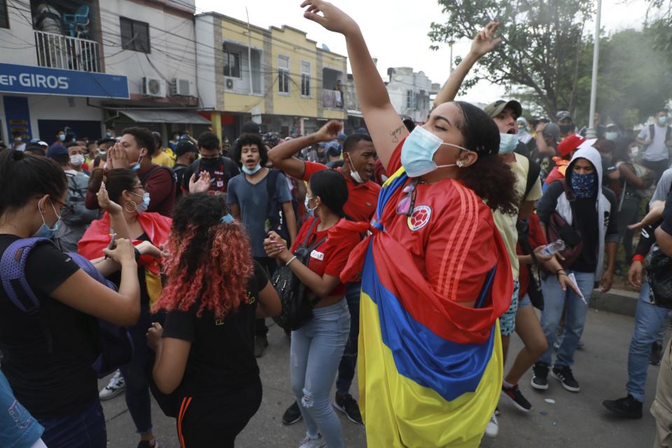 Anti-government demonstrators protest against the FIFA World Cup Qatar 2022 qualifying soccer match between Argentina and Colombia that will be played in Barranquilla, Colombia, Tuesday, June 8, 2021. (AP Photo/Jairo Cassiani)