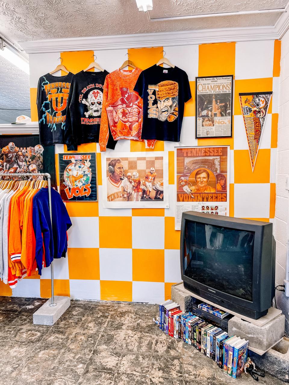 Four of Richie’s favorite T-shirts are displayed (and definitely not for sale) on the custom checkerboard wall.