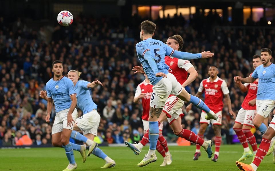 John Stones of Manchester City scores the team's second goal during the Premier League match between Manchester City and Arsenal - Michael Regan/Getty Images