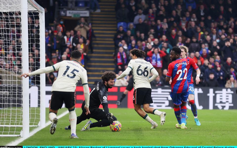 Alisson Becker of Liverpool saves a back heeled shot from Odsonne Edouard of CPFC - Getty