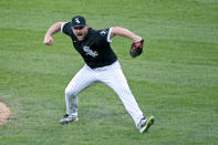 Chicago White Sox relief pitcher Liam Hendriks (31) reacts after winning the second baseball game of a doubleheader against the Baltimore Orioles, Saturday, May 29, 2021, in Chicago. (AP Photo/Matt Marton)