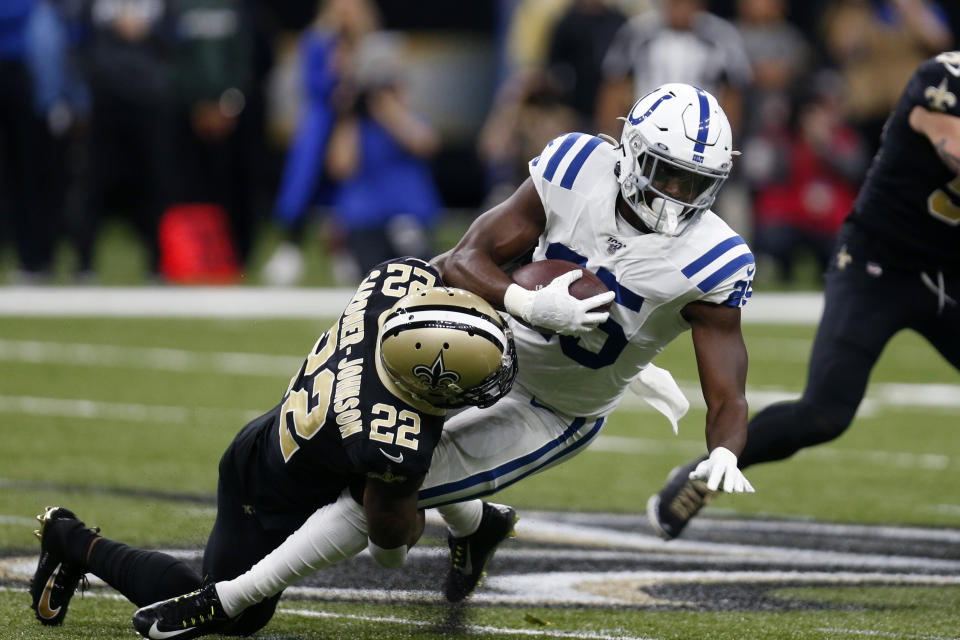 New Orleans Saints defensive back Chauncey Gardner-Johnson (22) tackles Indianapolis Colts running back Marlon Mack (25) in the first half of an NFL football game in New Orleans, Monday, Dec. 16, 2019. (AP Photo/Butch Dill)