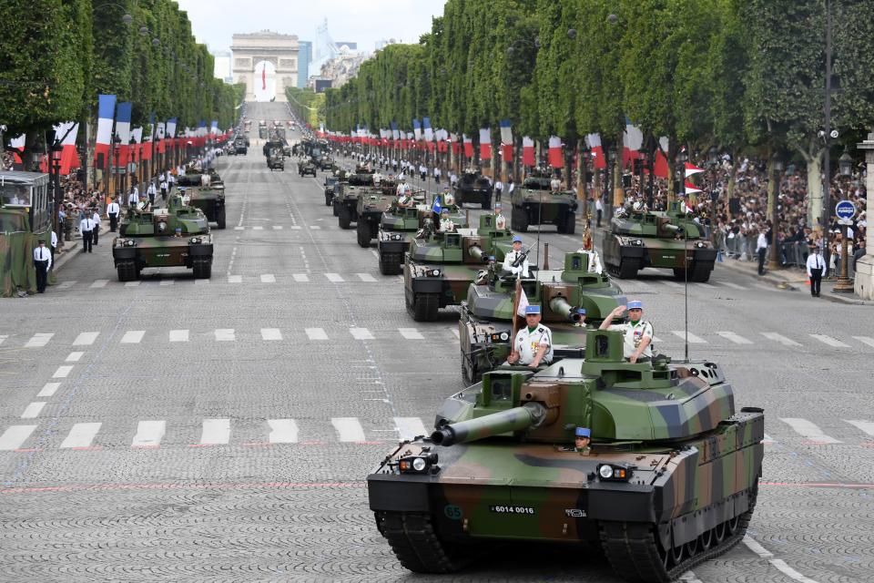 Members of the 5e Regiment de Dragons (5th Dragoon Regiment) parade on Leclerc tanks during the annual Bastille Day military parade on the Champs-Elysees avenue in Paris on July 14, 2017. | ALAIN JOCARD—AFP/Getty Images