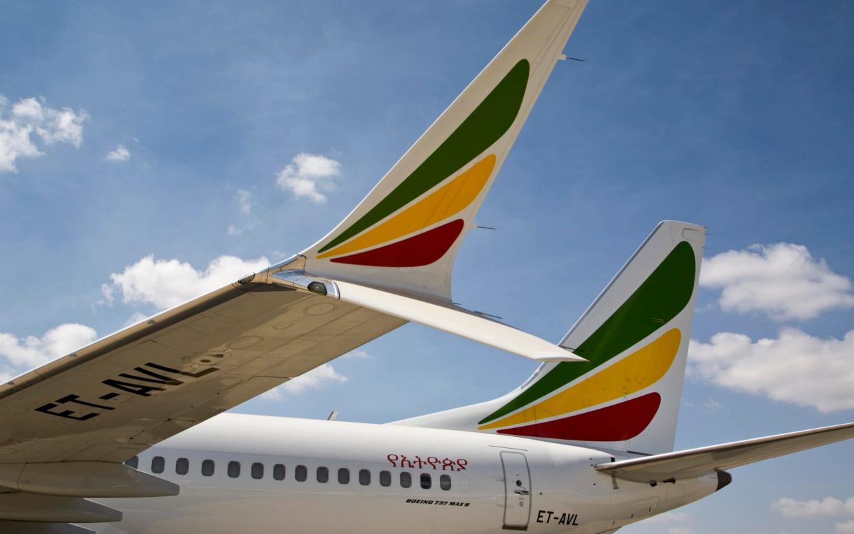 The winglet of an Ethiopian Airlines Boeing 737 Max 8 sits grounded at Bole International Airport in Addis Ababa, Ethiopia - AP