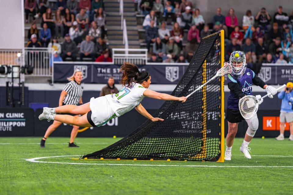 Dana Dobbie attempts a diving shot. (Premier Lacrosse League)