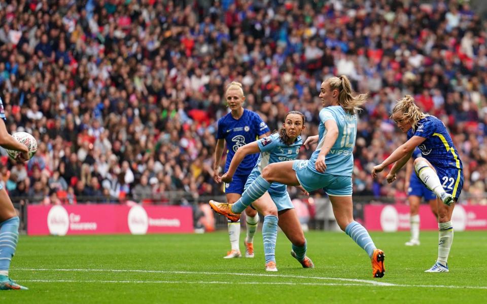 Chelsea's Erin Cuthbert (22) scores  - PA