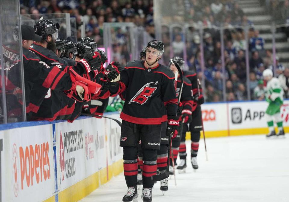Carolina Hurricanes defenseman Brady Skjei (76) celebrates at the bench after scoring a goal during the first period against the Toronto Maple Leafs at Scotiabank Arena.