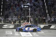 FILE - Kyle Larson takes the checkered flag to win the NASCAR Cup Series All-Star auto race at Texas Motor Speedway in Fort Worth, Texas, June 13, 2021. Reigning series Cup champion Larson has won his last two All-Star starts, last year in his debut season with Hendrick Motorsports after taking the checkered flag at the 2019 race in Charlotte while still with Chip Ganassi Racing. (AP Photo/Larry Papke, File)