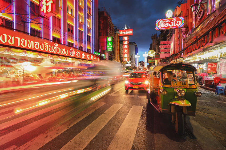 Selective focus on Tuk Tuk on busy Yaowarat Road in the evening in Bangkok Thailand. Getty Images