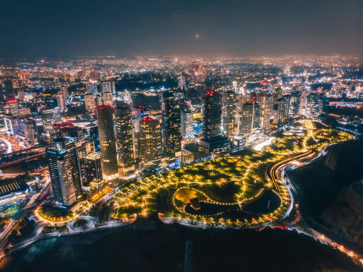 Mexico City is a popular destination that travelers can visit safely. pictured: the cityscape of Mexico City at night with bright lights