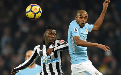 Fernandinho battles with Christian Atsu - Credit: AFP