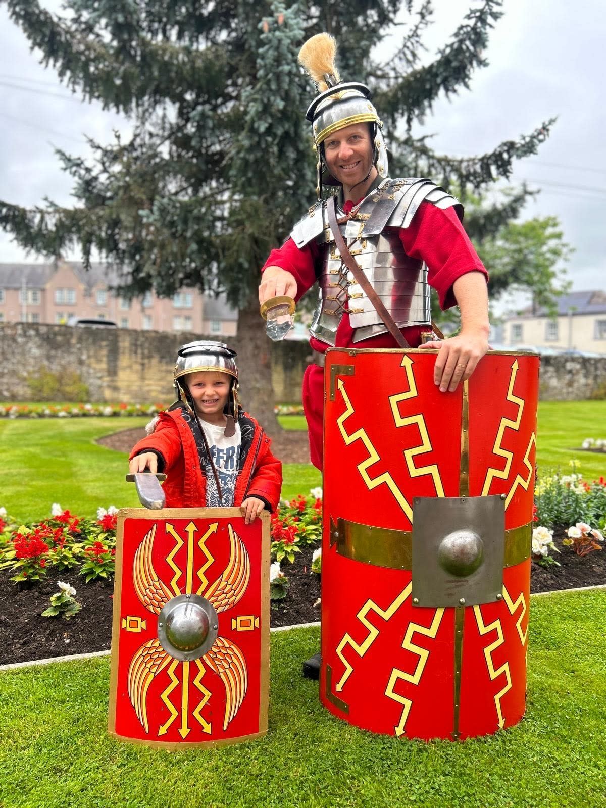 Father and son dressed in replica Roman solider gear