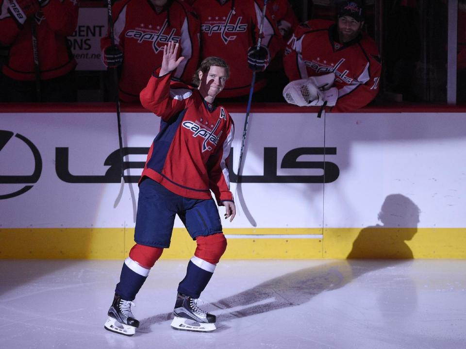 Washington Capitals center Nicklas Backstrom (19), of Sweden, waves to the crowd before an NHL hockey game against the Philadelphia Flyers, Sunday, Jan. 15, 2017, in Washington. Backstrom was honored in a pregame ceremony for being the first player in franchise history to record 500 assists. (AP Photo/Nick Wass)