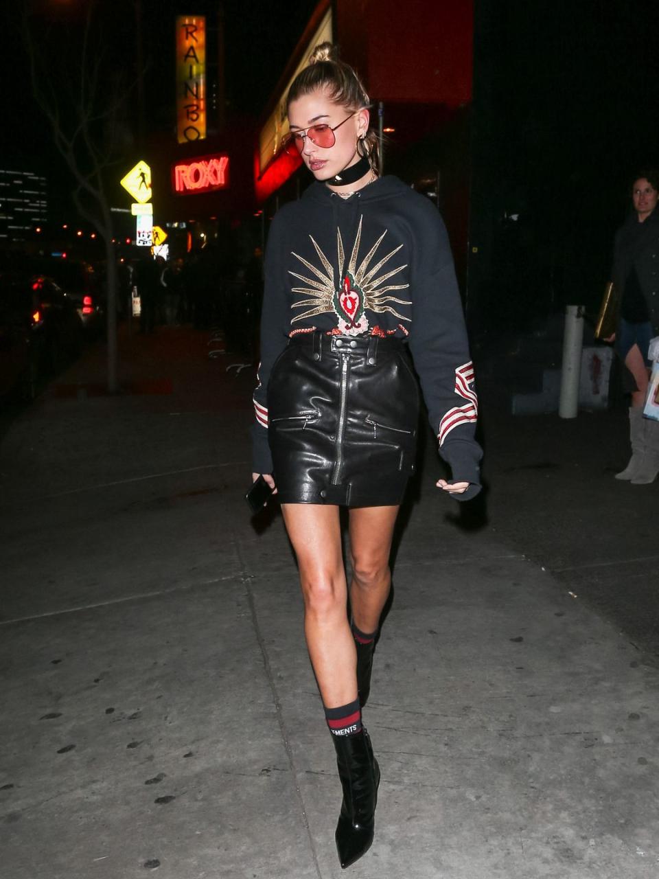 <p>Hailey Baldwin sported a black leather skirt and Sixties-inspired shades for an outing in L.A, January 2017.</p>