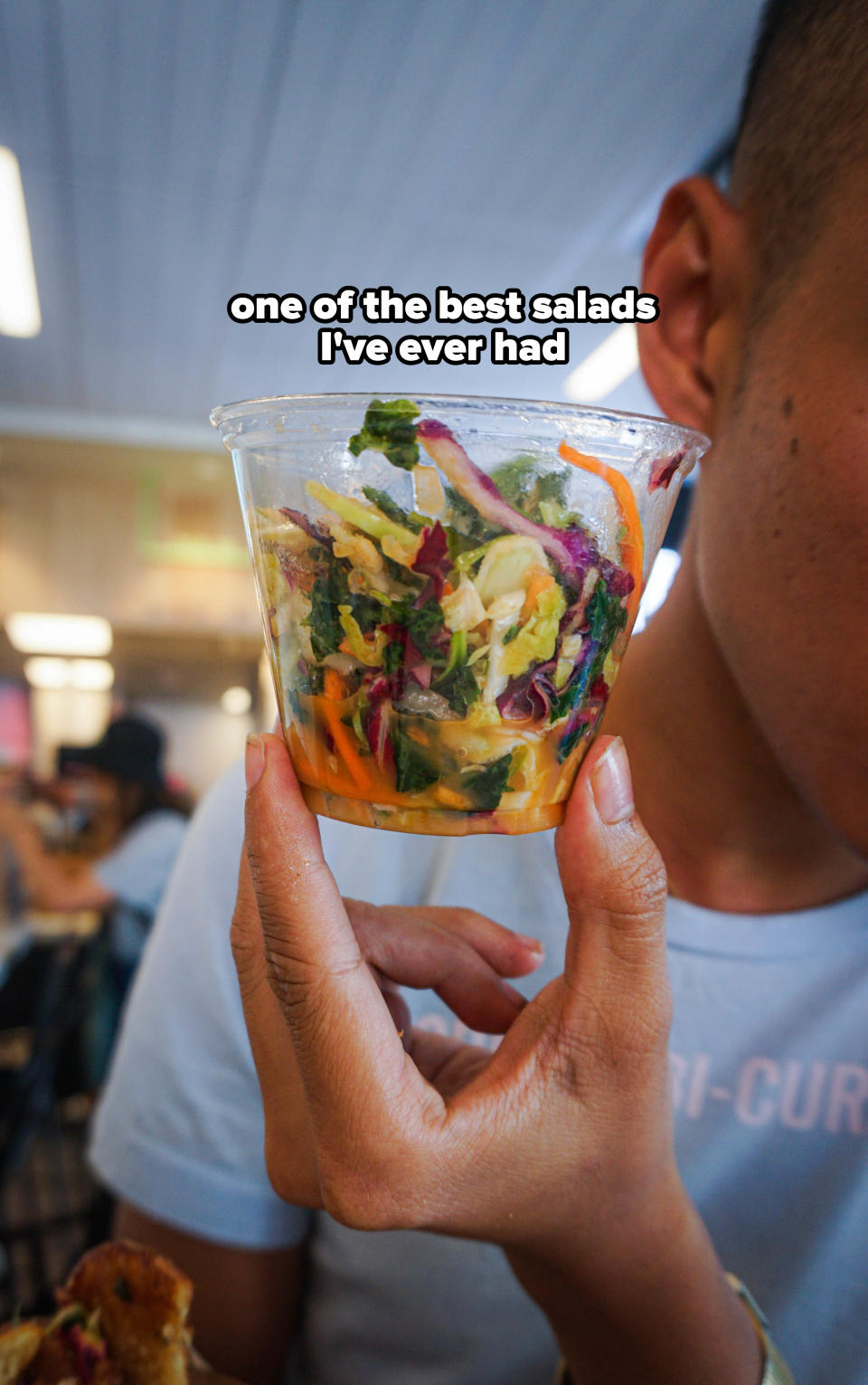 holding up the kale crunch salad