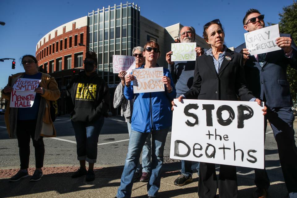 Supporters from the ACLU and community groups hold signs with the names of those who died in custody. Oct. 4, 2022
(Credit: Matt Stone/Courier Journal)