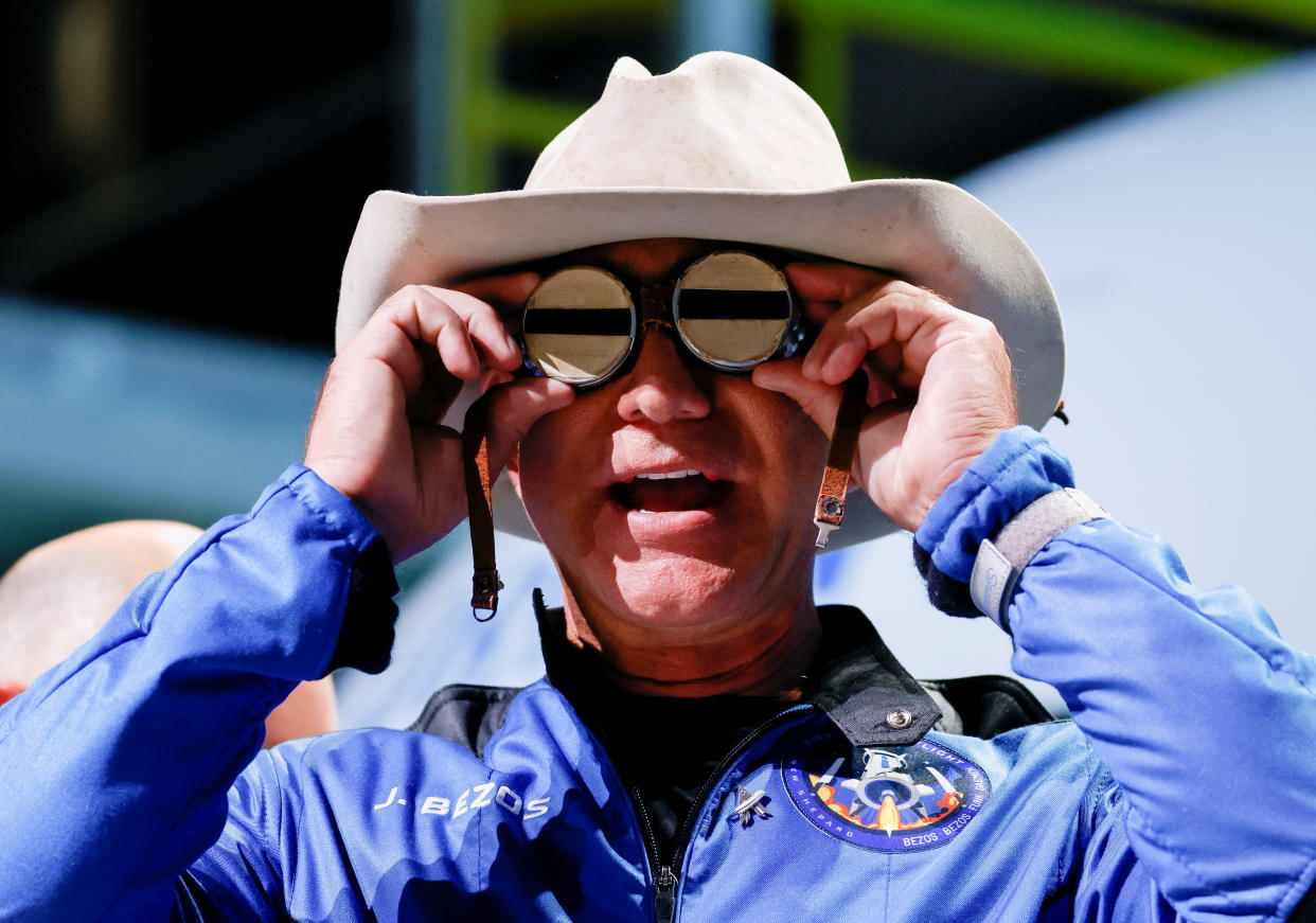 Billionaire American businessman Jeff Bezos wears goggles owned by Amelia Earhart which he carried into space at a post-launch press conference after he flew on Blue Origin's inaugural flight to the edge of space, in the nearby town of Van Horn, Texas, U.S. July 20, 2021.   REUTERS/Joe Skipper     TPX IMAGES OF THE DAY