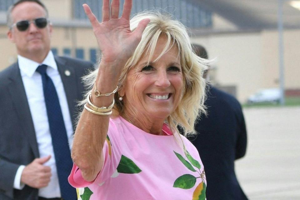 Jill Biden waves before boarding Air Force One to depart Joint Base Andrews in Maryland on August 10  (AFP via Getty Images)