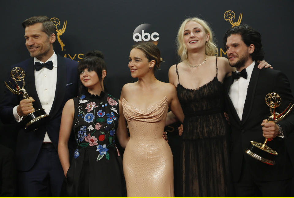 Nikolaj Coster-Waldau (L), Maisie Williams, Emilia Clarke, Sophie Turner and Kit Harrington of HBO's "Game of Thrones" pose backstage with their award for Oustanding Drama Series at the 68th Primetime Emmy Awards in Los Angeles, California U.S., September 18, 2016.  REUTERS/Mike Blake