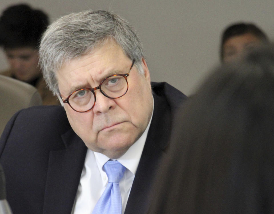 U.S. Attorney General William Barr, right, listens to concerns raised about public safety in rural Alaska during at a roundtable discussion at the Alaska Native Tribal Health Consortium on Wednesday, May 29, 2019, in Anchorage, Alaska. Barr did not take questions from reporters in his first public appearance after former special prosecutor Robert Mueller spoke to reporters after resigning at the completion of his report into Russian interference into the 2016 election. (AP Photo/Mark Thiessen)