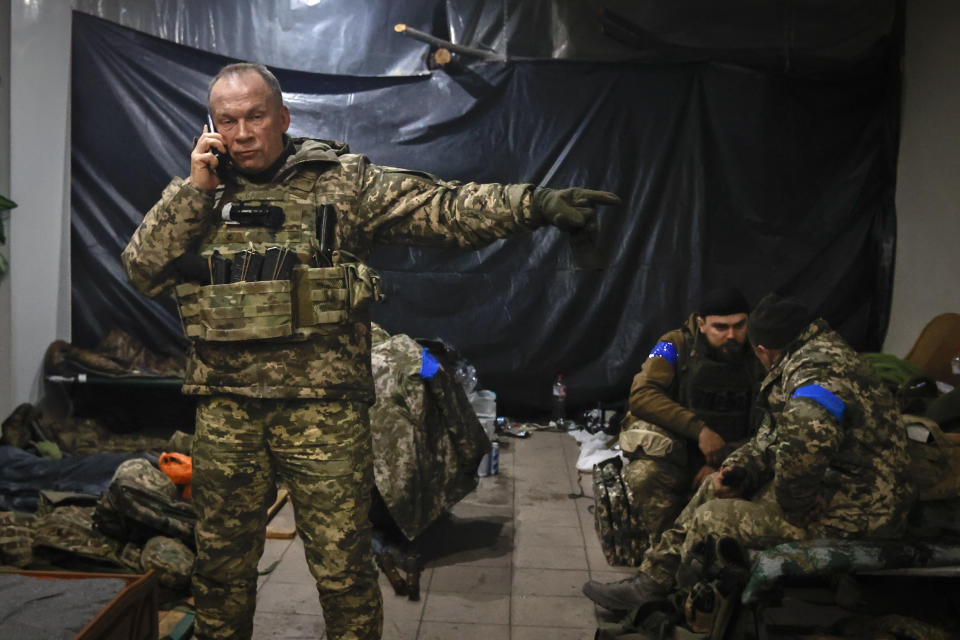 Commander of the Ukrainian army, Col. Gen. Oleksandr Syrskyi, gives instructions in a shelter in Soledar, the site of heavy battles with the Russian forces, in the Donetsk region, Ukraine, Sunday, Jan. 8, 2023. (AP Photo/Roman Chop)