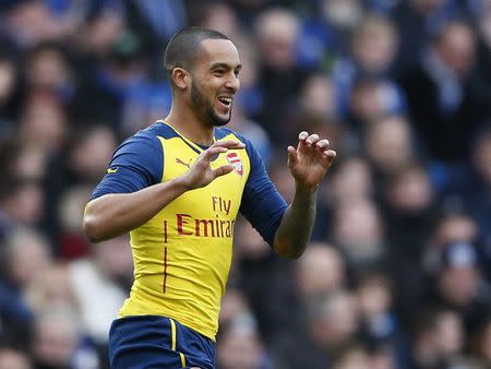 Arsenal's Theo Walcott celebrates after scoring a goal against Brighton and Hove Albion during their FA Cup fourth round soccer match at the Amex stadium in Brighton, southern England January 25, 2015. REUTERS/Stefan Wermuth