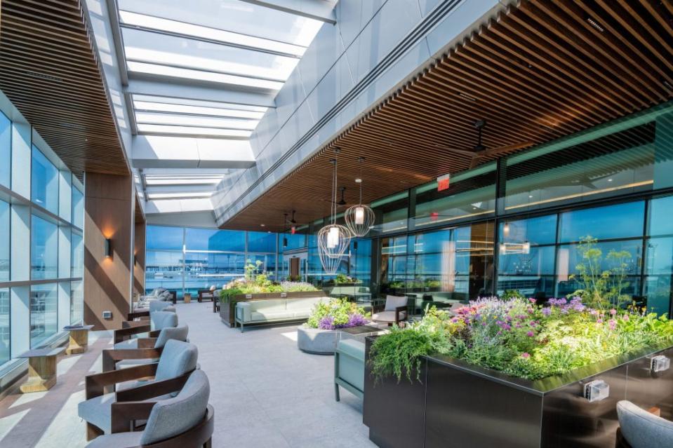 Travelers can enjoy views of the airfield from the lounge's terrace, a lush outdoor oasis open 365 days out of the year.