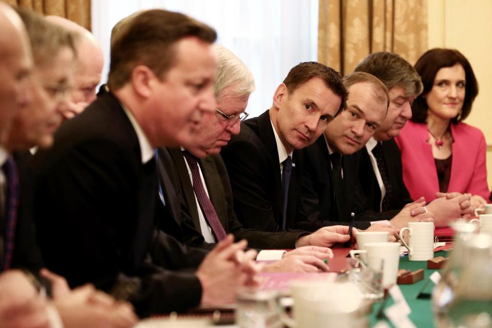 Ed Davey around the cabinet table during the coalition years (PA)