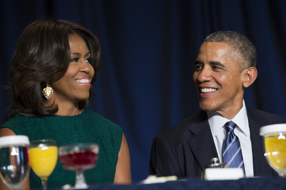 President Barack Obama and first lady Michelle Obama share a laugh during the National Prayer Breakfast in Washington, Thursday, Feb. 5, 2015.  