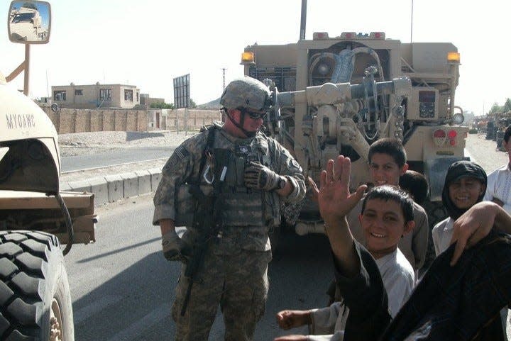U.S. Army Sgt. Michael Keene pictured with local children while serving in the Middle East.
