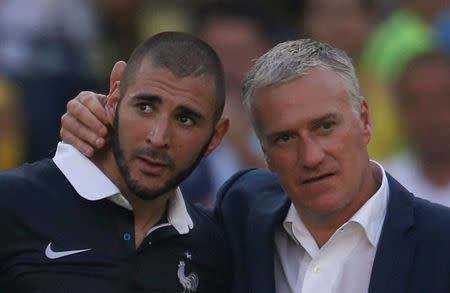 France's coach Didier Deschamps (R) consoles Karim Benzema after the team's 2014 World Cup quarter-finals against Germany at the Maracana stadium in Rio de Janeiro, Brazil, in this July 4, 2014 file photo. Picture taken July 4, 2014. REUTERS/Charles Platiau/Files