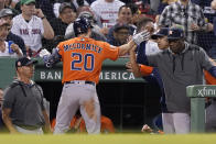 Houston Astros' Chas McCormick (20) is welcomed to the dugout after hitting a home run in the fifth inning of a baseball game against the Boston Red Sox, Monday, May 16, 2022, in Boston. (AP Photo/Steven Senne)