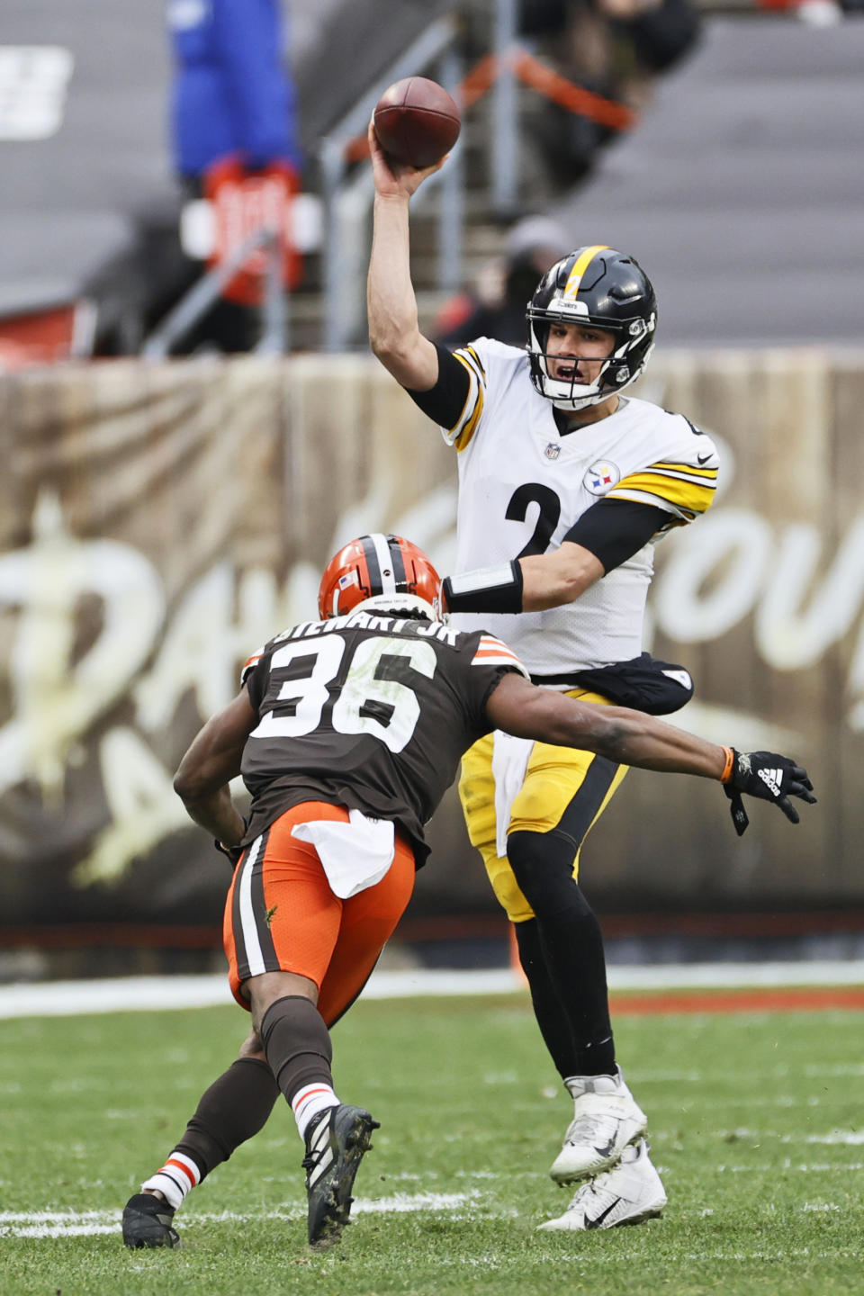 Cleveland Browns cornerback M.J.Stewart Jr. (36) rushes Pittsburgh Steelers quarterback Mason Rudolph (2) during the first half of an NFL football game, Sunday, Jan. 3, 2021, in Cleveland. (AP Photo/Ron Schwane)