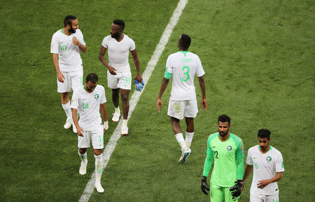 Soccer Football - World Cup - Group A - Uruguay vs Saudi Arabia - Rostov Arena, Rostov-on-Don, Russia - June 20, 2018 Saudi Arabia players look dejected after the match REUTERS/Marcos Brindicci