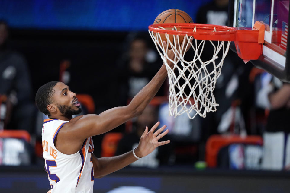 Phoenix Suns forward Mikal Bridges (25) makes a basket during the second half of an NBA basketball game Tuesday, Aug. 11, 2020, in Lake Buena Vista, Fla. (AP Photo/Ashley Landis, Pool)