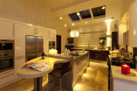 <p>The beautiful kitchen and breakfast bar are perfect for cooking for a large number of people at a dinner party.</p>