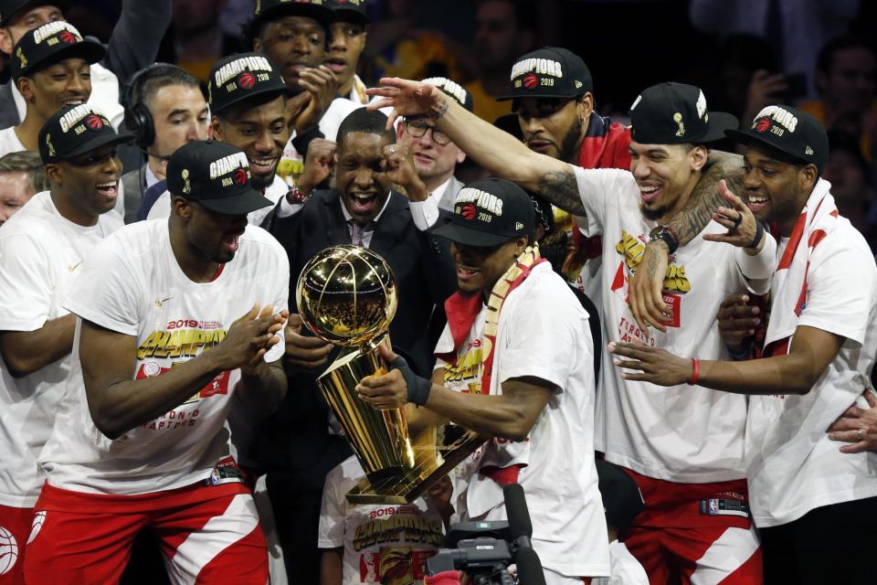 Toronto Raptors celebrate with the Larry O'Brien Championship Trophy after beating the Golden State Warriors in June. (Getty Images)