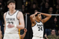 Iowa forward Kris Murray (24) reacts after being called for a foul during the second half of an NCAA college basketball game against Michigan, Thursday, Feb. 17, 2022, in Iowa City, Iowa. (AP Photo/Charlie Neibergall)