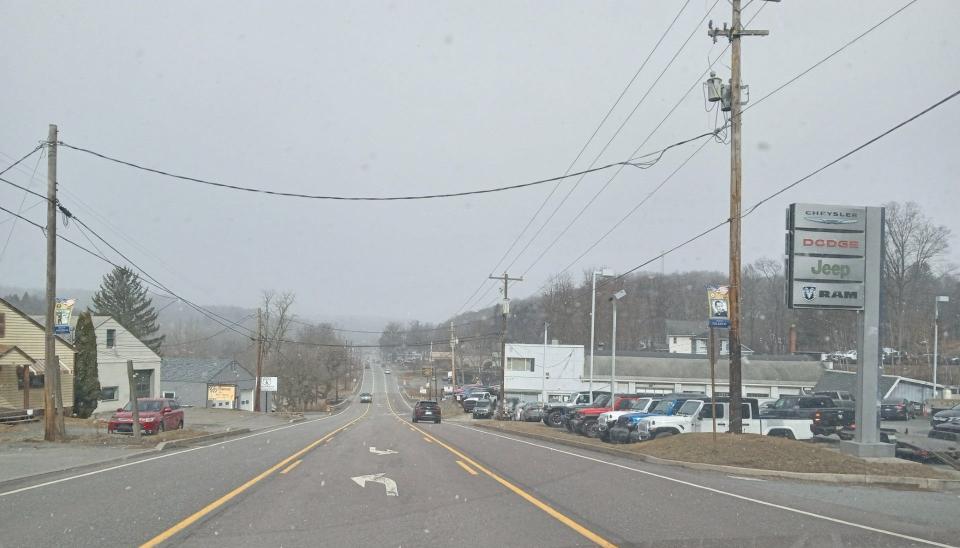 This view looking west down the hill on Grandview Avenue (pausing briefly and safely in the turning lane) shows Honesdale Chrysler Dodge Jeep Ram at right and Chad Weigelt's used car business, Route 6 Sales & Service, third building from left.