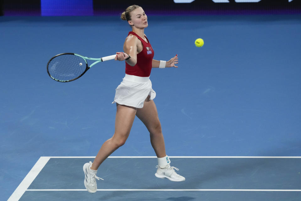 Norway's Malene Helgo plays a forehand return to Caroline Garcia of France during their United Cup quarterfinal tennis match in Sydney, Australia, Thursday, Jan. 4, 2024. (AP Photo/Mark Baker)