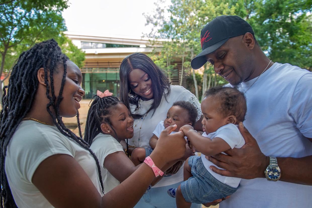 Arnisha Jones of Jackson, center, juggles all that life hands her. With four children, Ne’Vael Jefferson, 11, from left, Nyla Jefferson, 7, and four-month-old twin sons Amari, held by Jones, and Khamari, held by the twins' father Curtis Spires Sr., she has her hands full on Monday, April 29, 2024. Just weeks after she gave birth to the twins, she was diagnosed with Stage 2 breast cancer. Jones is currently undergoing chemotherapy.