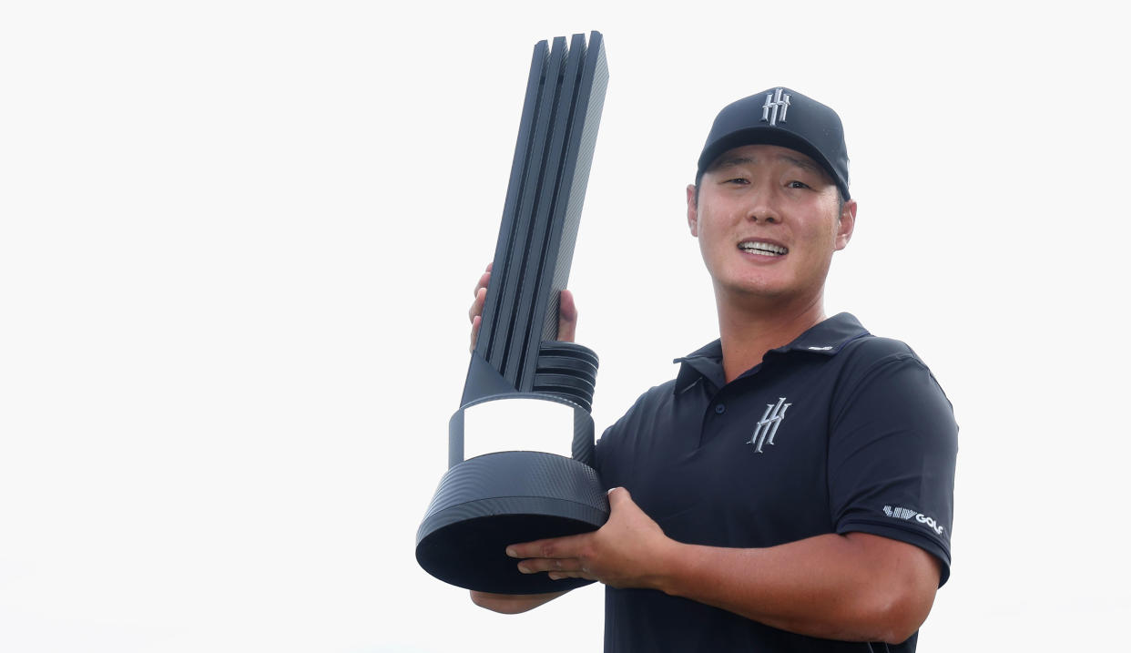  Danny Lee holds the trophy after his LIV win 