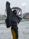 Hamilton Tiger-Cats' Andy Fantuz puts his sweater on in the extreme cold during the team practice in Regina, Saskatchewan, November 20, 2013. The Saskatchewan Roughriders will play the Hamilton Tiger-Cats in the CFL's 101st Grey Cup in Regina November 24. REUTERS/Todd Korol (CANADA - Tags: SPORT FOOTBALL)