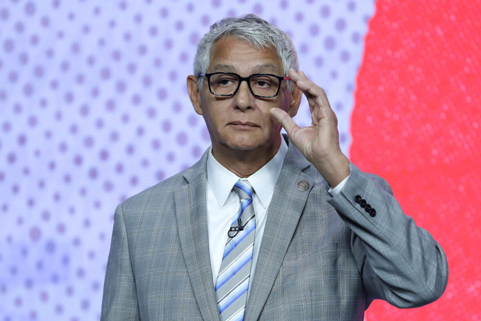 Houston mayoral candidate Robert Gallegos adjusts his glasses as he listens to a question during a candidates debate held at the Houston Public Media studios Thursday, Oct. 19, 2023, in Houston. (AP Photo/Michael Wyke)