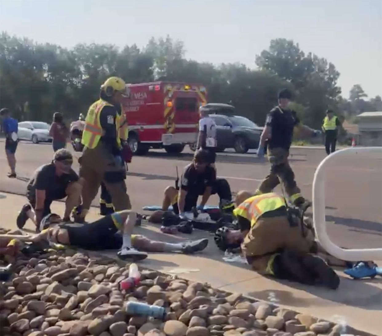 This photo provided by Tony Quinones shows the aftermath of a truck ramming into a crowd of bikers Saturday, June 19, 2021, in Show Low, Ariz. Authorities in the small city of Show Low said the unidentified 35-year-old male suspect fled the crash scene in the pickup and was shot and wounded by officers a short time later.  Of the seven cyclists hospitalized, six were in critical condition, and one was in stable condition on Sunday, June 20, 2021, police said in a statement. (Tony Quinones via AP)