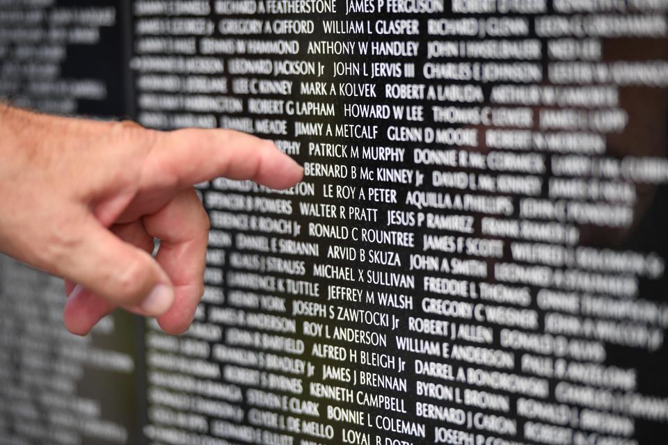 Ron Melyan of Punta Gorda points to names of some friends he lost during the Battle of Lo Giang during the Vietnam War. Melyan said his unit "lost 19 guys in five minutes on Feb. 8, 1968." "I come here to let them know they're not forgotten at all."