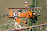 Nine-year-old cousins Rose Powell (front) and Flame Brewer wingwalking over Rendcomb Airfield near Cirencester for the charity Duchenne Children's Trust, becoming the World's youngest formation wingwalkers.