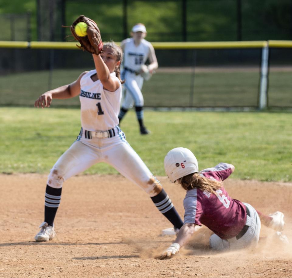 HarrisonÕs Alexia Cozzali steals second as Ursuline Jessica Tejera takes the late throw during a Section 1 Class A softball semifinal game at Harrison High School May 23, 2023. Ursuline scored three runs in the sixth inning to defeat Harrison 8-5. 