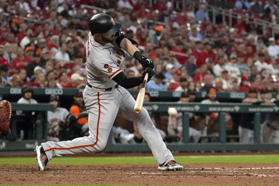 San Francisco Giants' Mitch Haniger hits an RBI single during the seventh inning of a baseball game against the St. Louis Cardinals Monday, June 12, 2023, in St. Louis. (AP Photo/Jeff Roberson)
