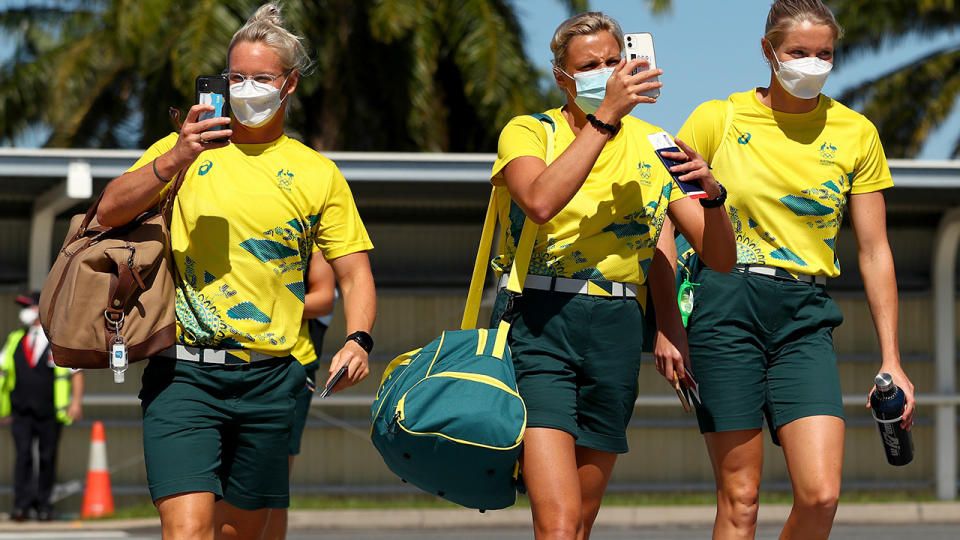 Australian athletes, pictured here on the tarmac at Cairns Airport as they head to Tokyo.